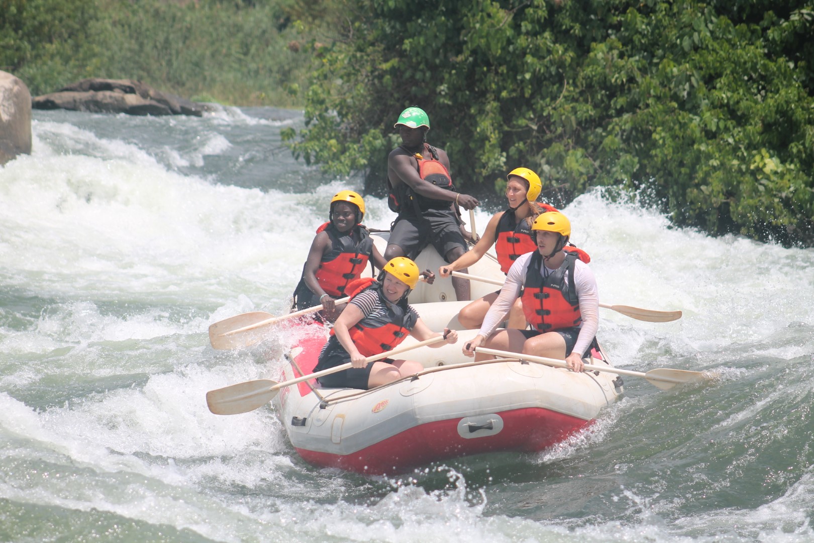 Rafting group paddling together on the River Nile